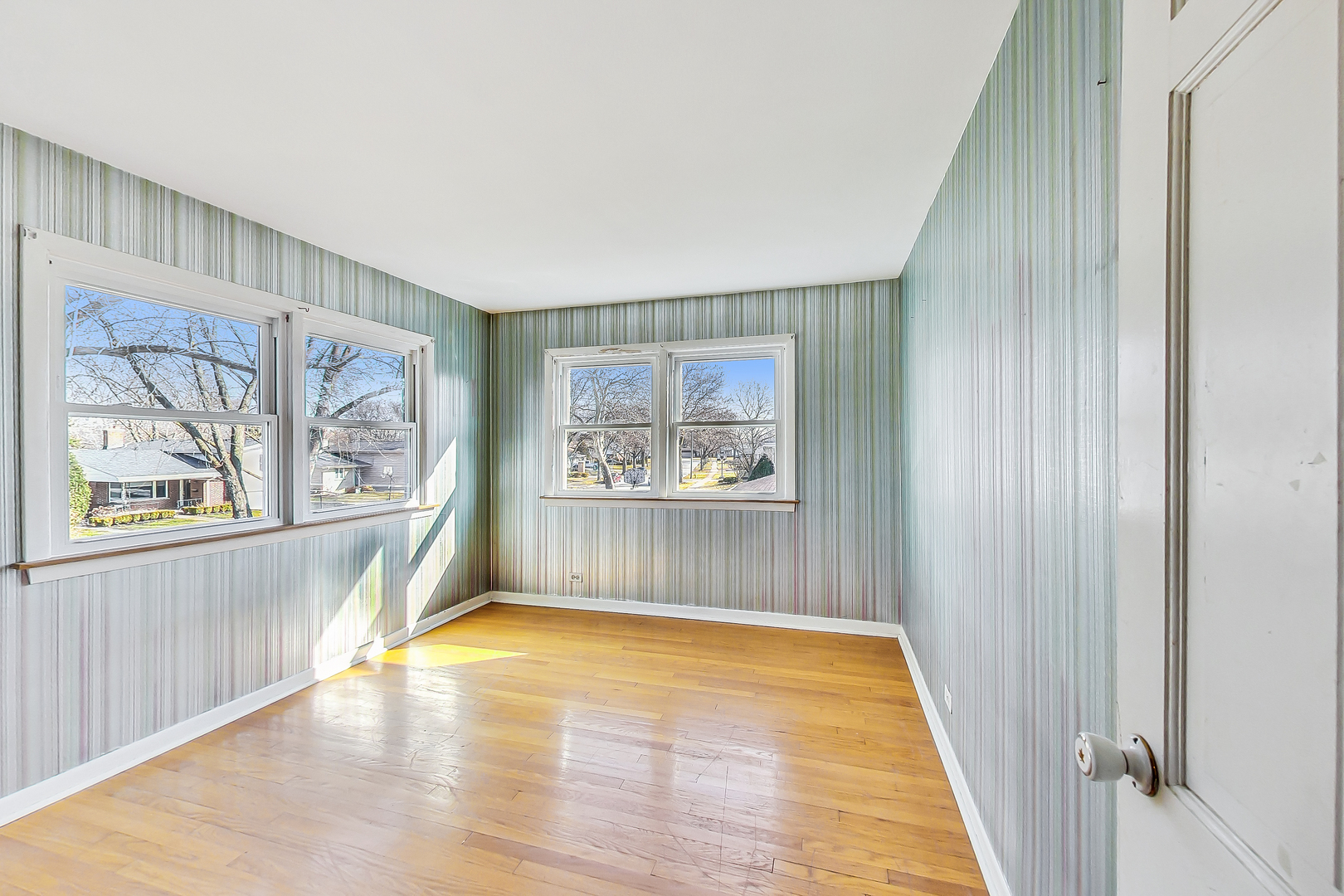 2101 Walnut Street Park Ridge, IL 60068 - Photo 22 of 37 a view of an empty room with a window and wooden floor