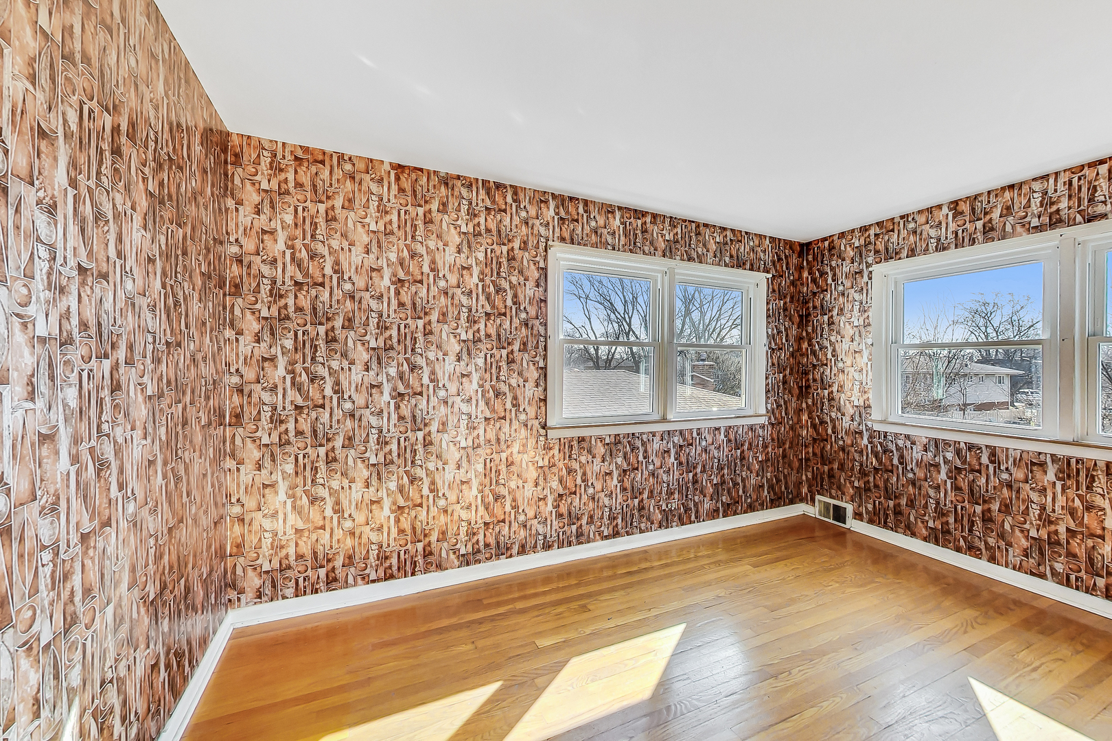 2101 Walnut Street Park Ridge, IL 60068 - Photo 23 of 37 a view of an empty room with a window and wooden floor