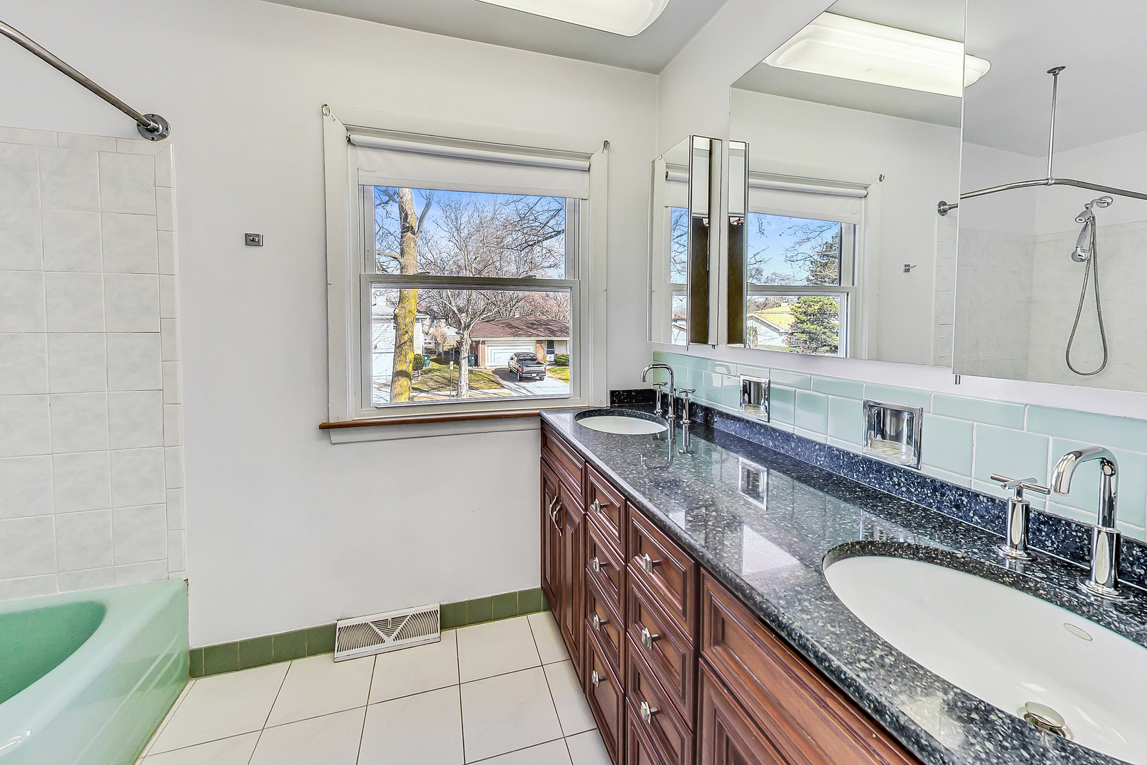 2101 Walnut Street Park Ridge, IL 60068 - Photo 25 of 37 a bathroom with a granite countertop sink a mirror a bathtub and next to a window