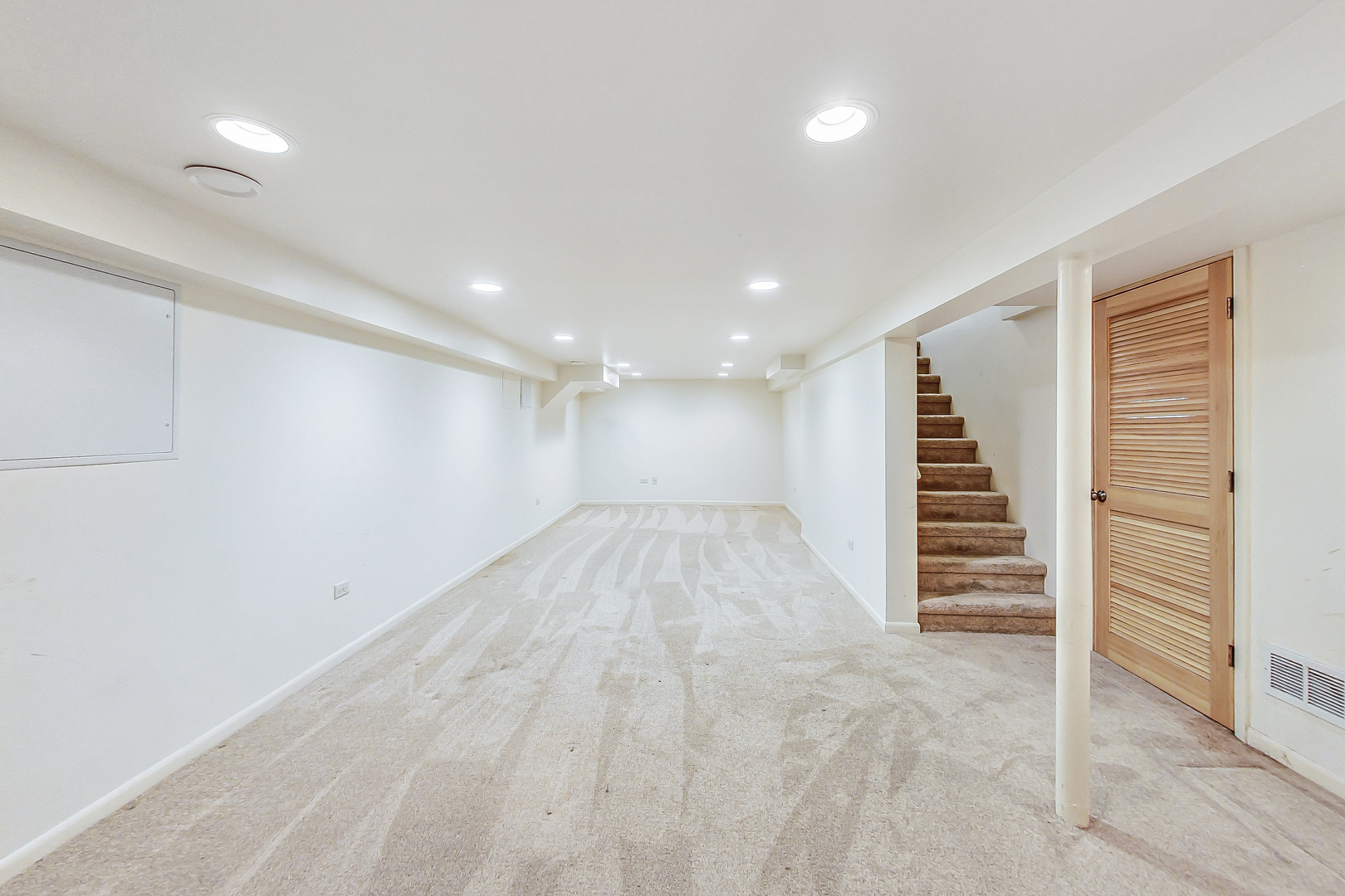 2101 Walnut Street Park Ridge, IL 60068 - Photo 26 of 37 an empty room with wooden floor and stairs