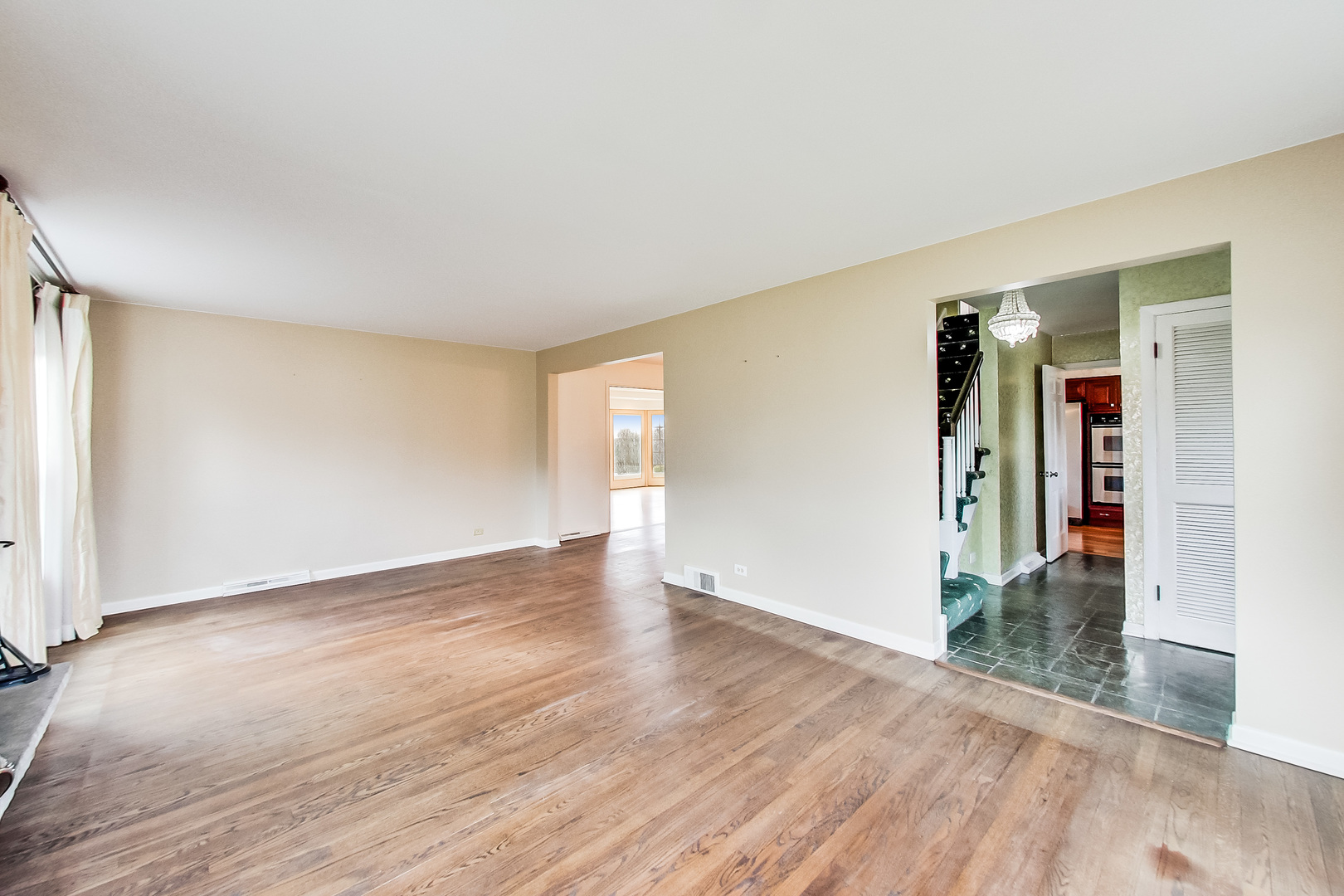 2101 Walnut Street Park Ridge, IL 60068 - Photo 6 of 37 an empty room with wooden floor and windows