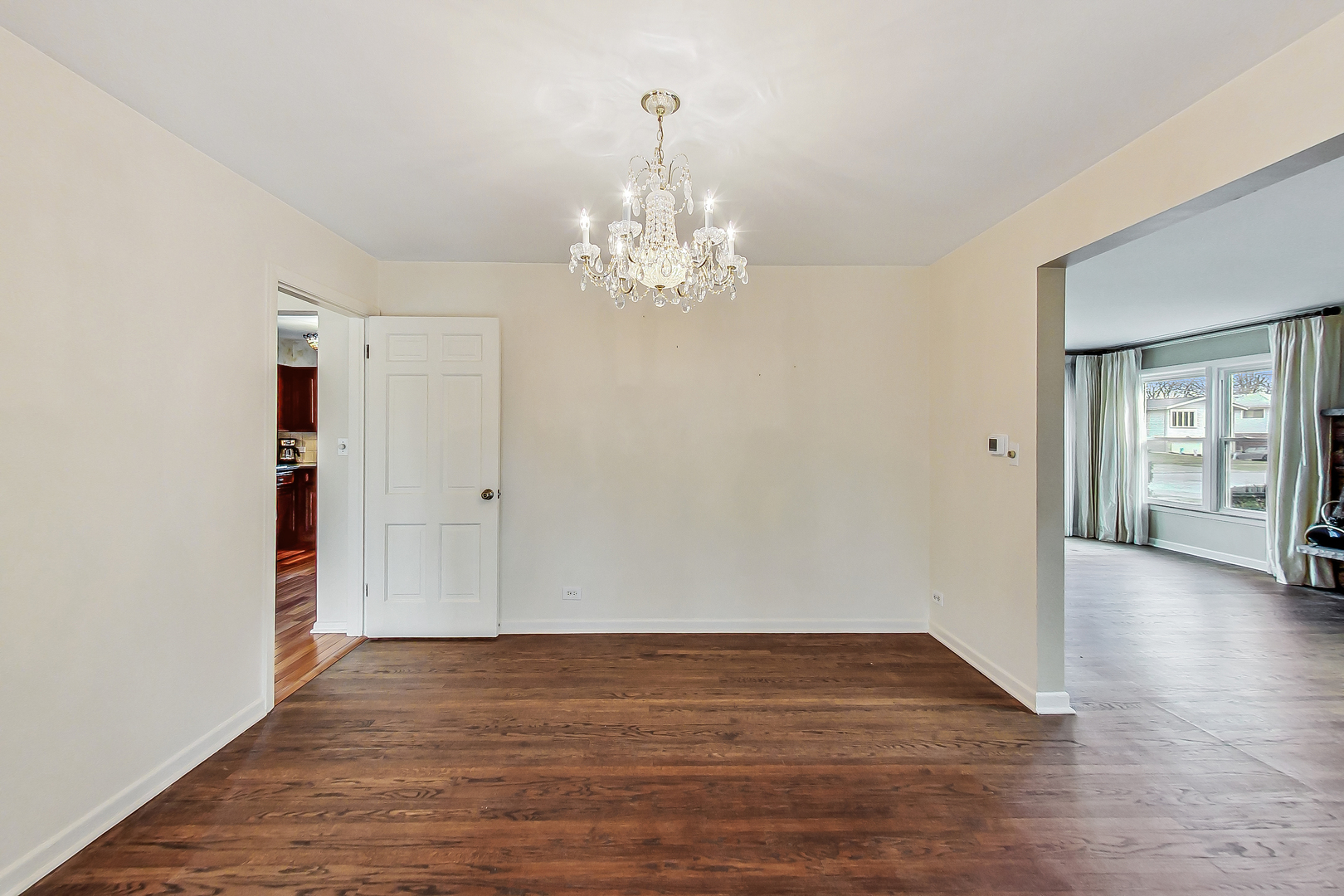 2101 Walnut Street Park Ridge, IL 60068 - Photo 8 of 37 a view of an empty room with wooden floor and a window