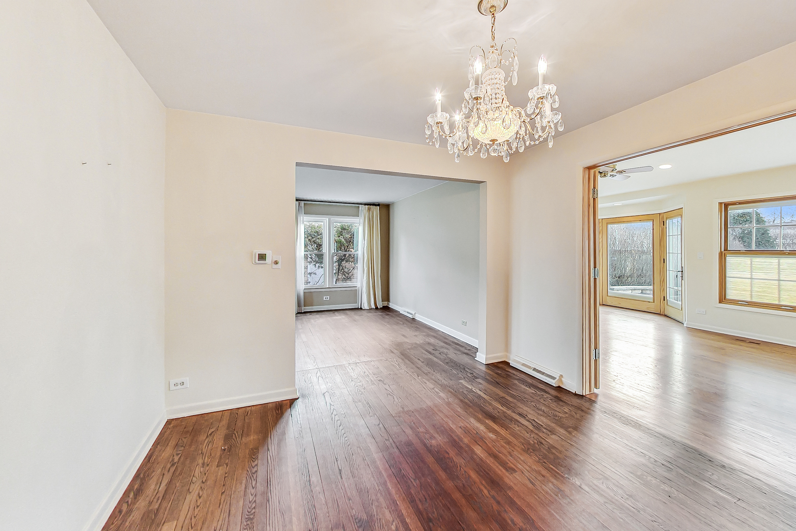 2101 Walnut Street Park Ridge, IL 60068 - Photo 9 of 37 a view of an empty room with wooden floor and a window