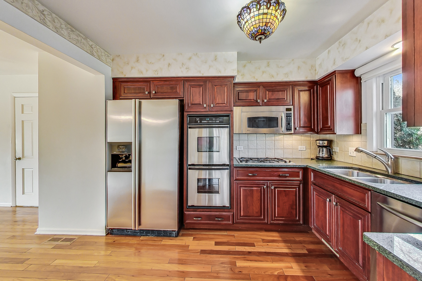 2101 Walnut Street Park Ridge, IL 60068 - Photo 10 of 37 a kitchen with stainless steel appliances granite countertop a refrigerator and a sink