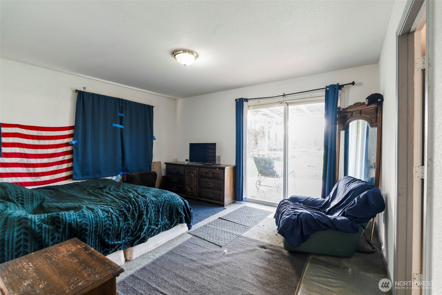 126 Bethany Lane Winlock, WA 98596 - Photo 12 of 37 a bedroom with a bed and a couch