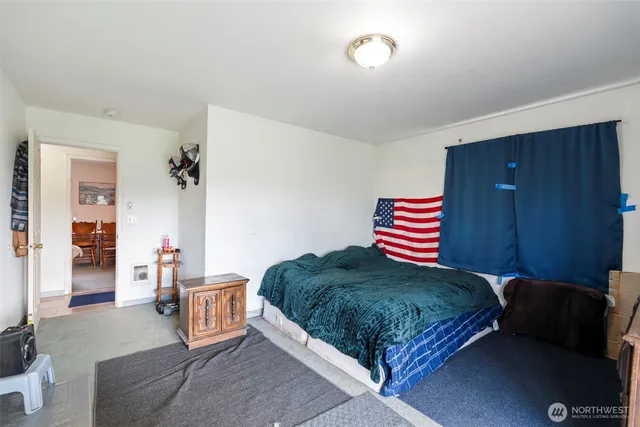 a bedroom with a bed and dresser