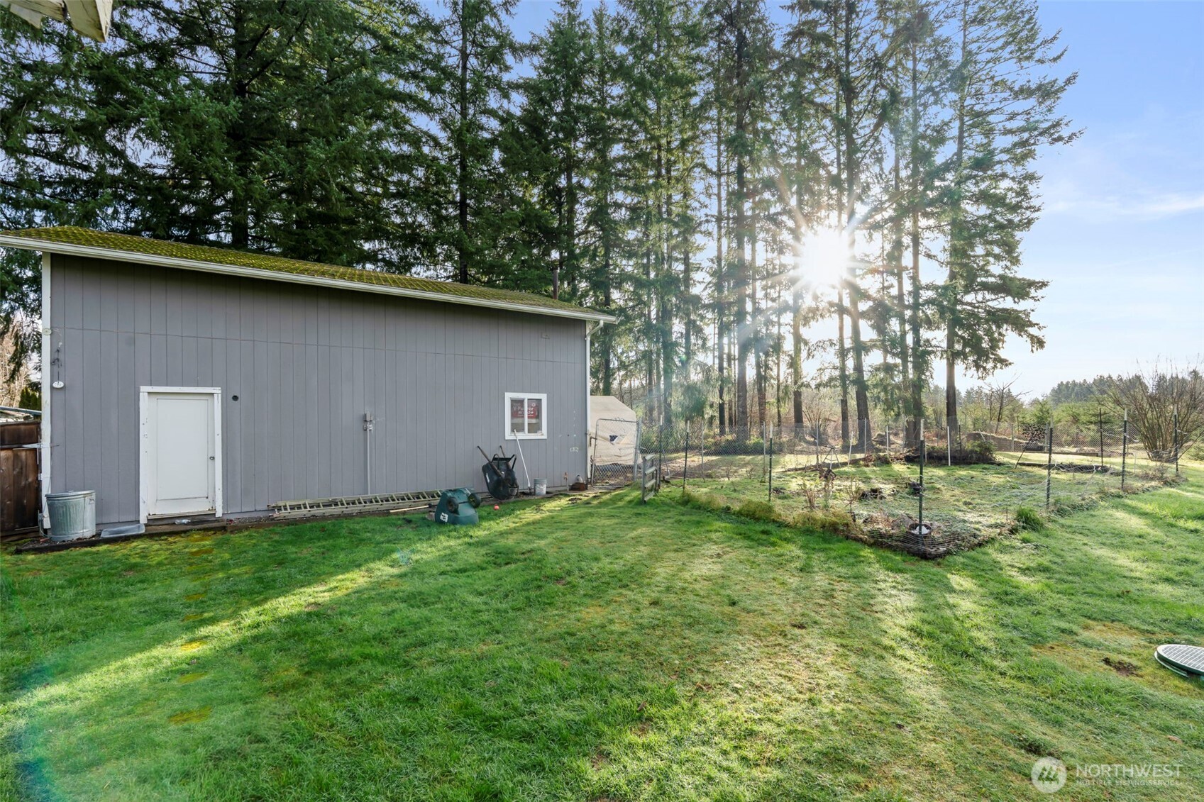 126 Bethany Lane Winlock, WA 98596 - Photo 25 of 37 a view of a backyard with a garden and trees