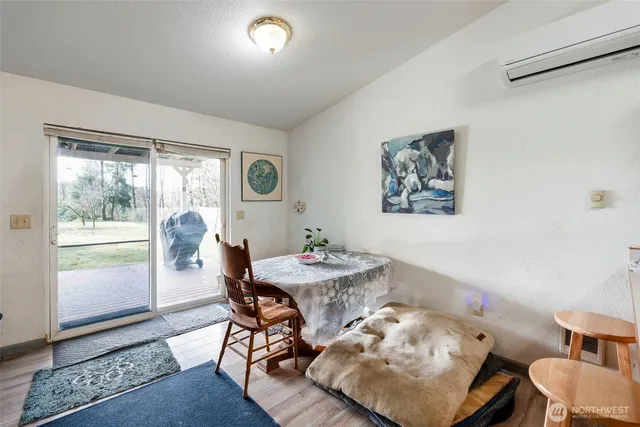 a dining room with furniture and window