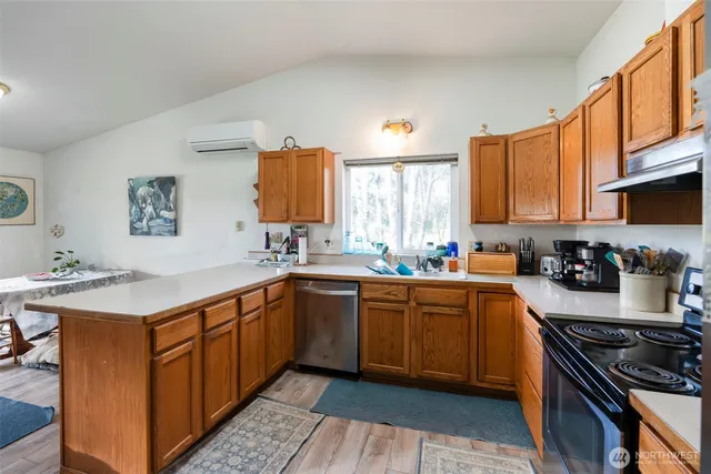 a kitchen with a sink stove top oven and cabinets