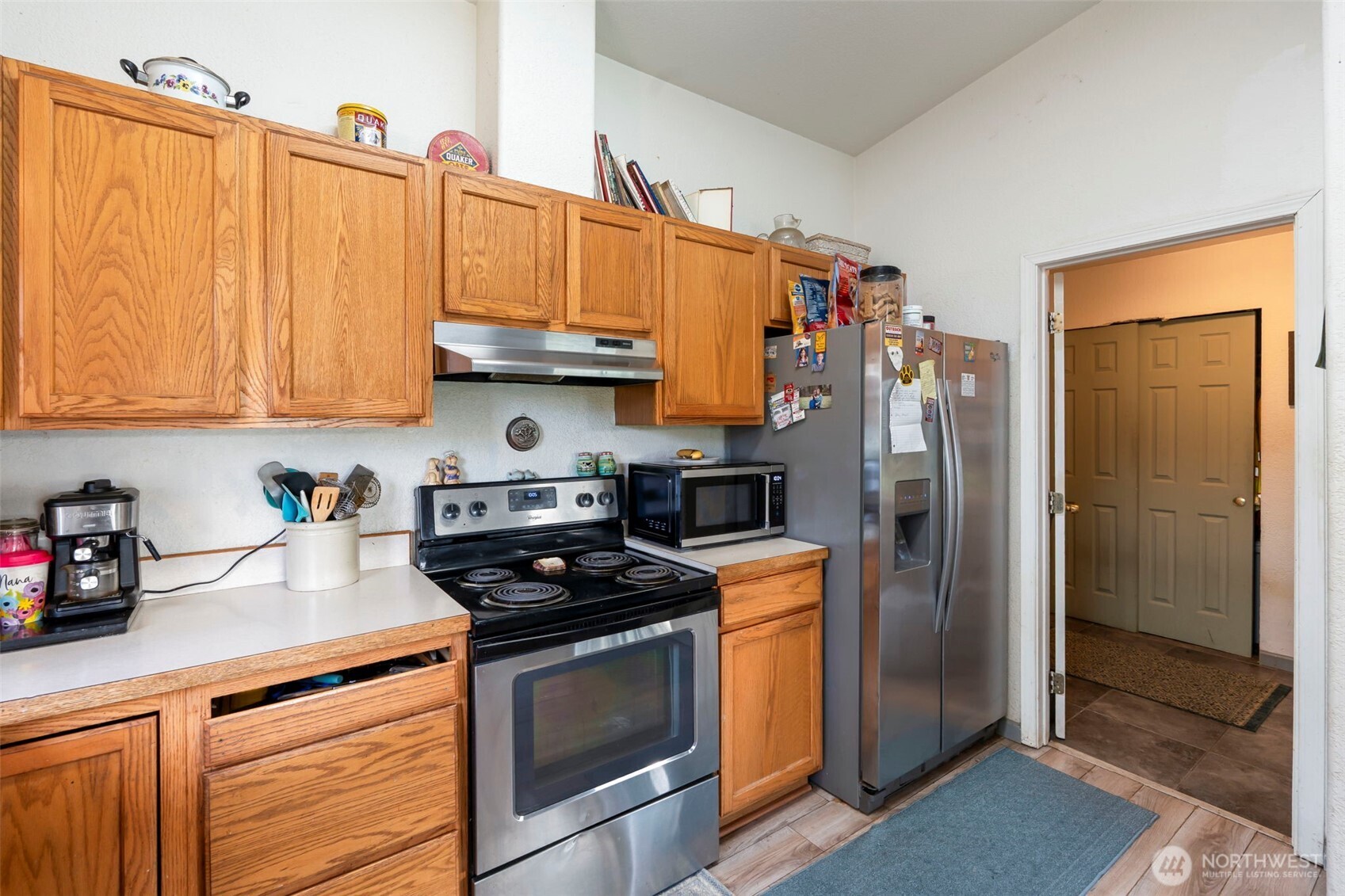 126 Bethany Lane Winlock, WA 98596 - Photo 10 of 37 a kitchen with stainless steel appliances granite countertop a refrigerator sink and cabinets