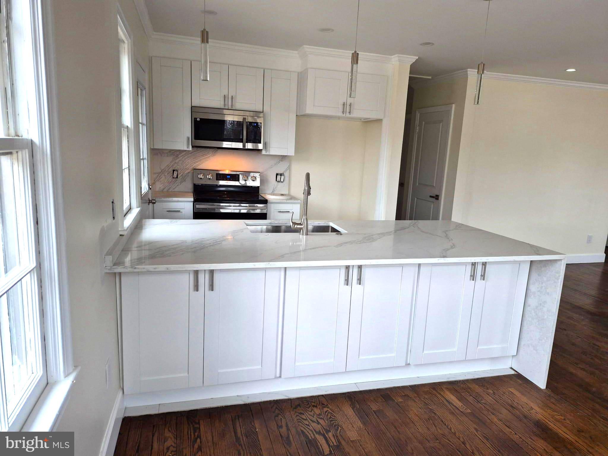 REMODELED KITCHEN W/ A LOT OF CABINETS FOR STORAGE