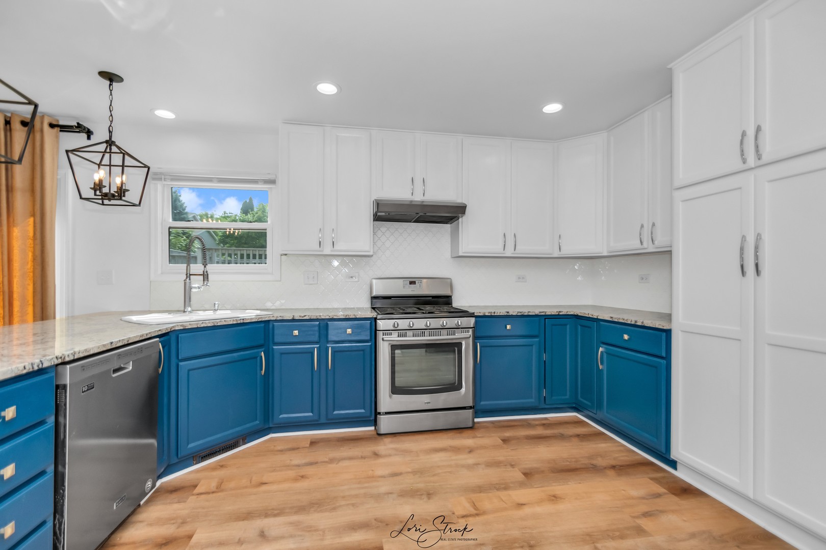 2844 Weld Road Elgin, IL 60124 - Photo 17 of 43 a kitchen with stainless steel appliances granite countertop a stove and a sink