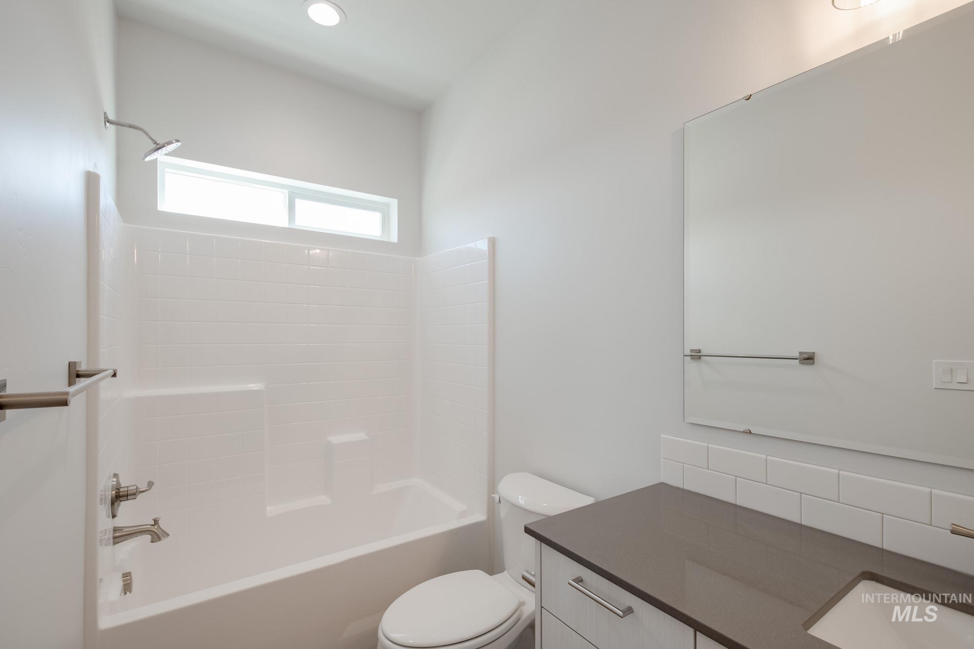 6447 South Sunfish Way Boise, ID 83709 - Photo 27 of 29 Bathroom featuring vanity, shower / bath combination, and recessed lighting
