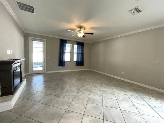 a view of an empty room and window