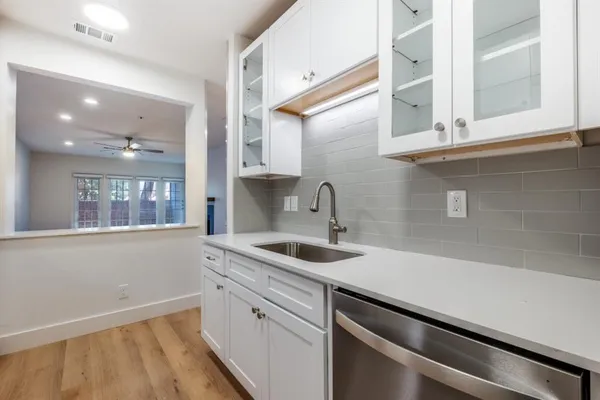 a kitchen with a sink and cabinets