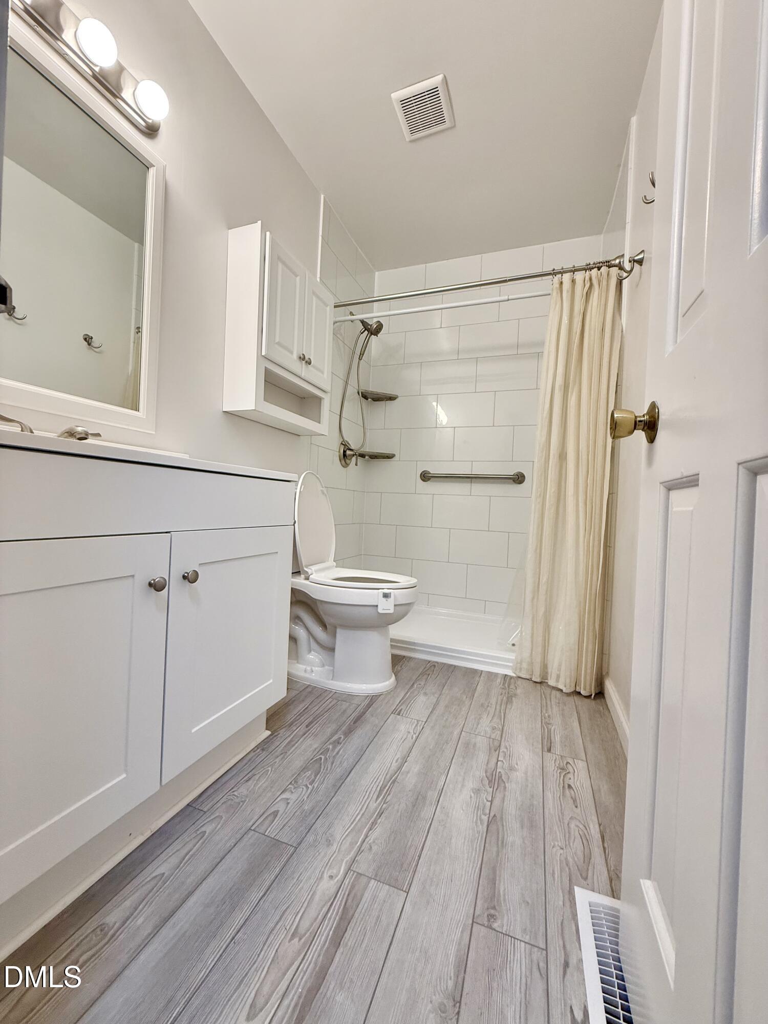 3517 Morningside Drive Raleigh, NC 27607 - Photo 11 of 14 a bathroom with a sink a toilet and shower