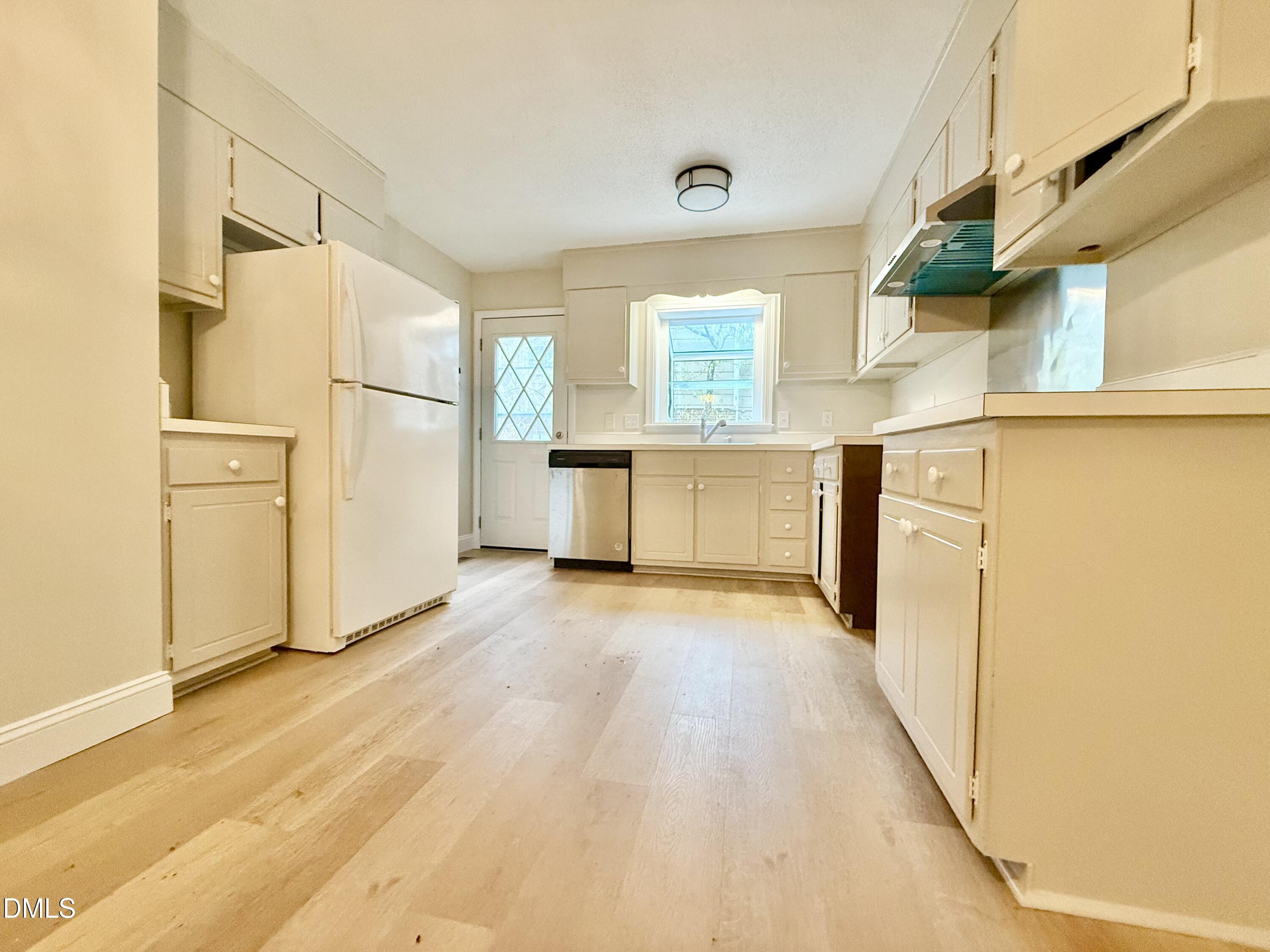 3517 Morningside Drive Raleigh, NC 27607 - Photo 7 of 14 a view of a kitchen with wooden floor and electronic appliances