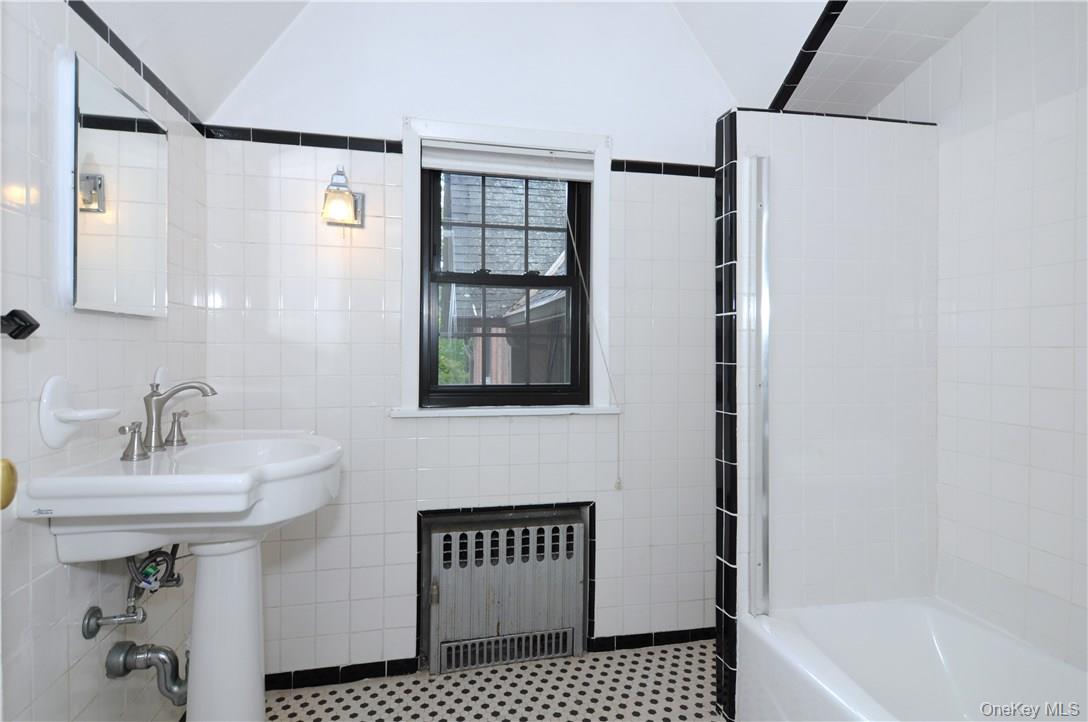 136 Harriman Road, Unit 2 Irvington, NY 10533 - Photo 20 of 23 a bathroom with a sink and a bathtub