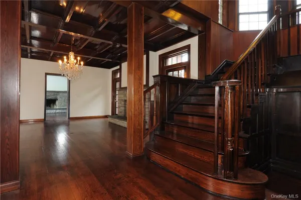 a view of entryway with wooden floor