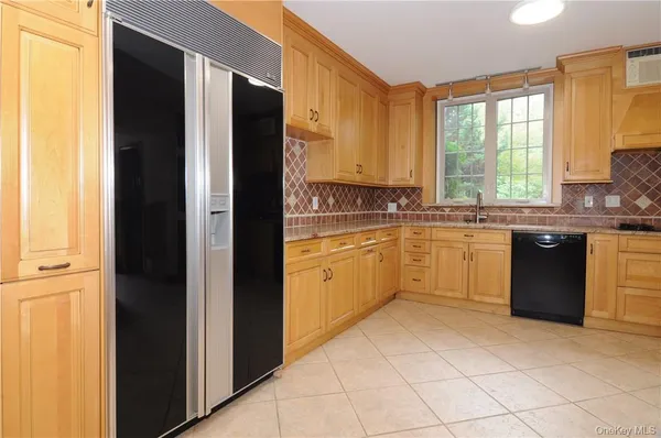 a kitchen with a sink and a refrigerator