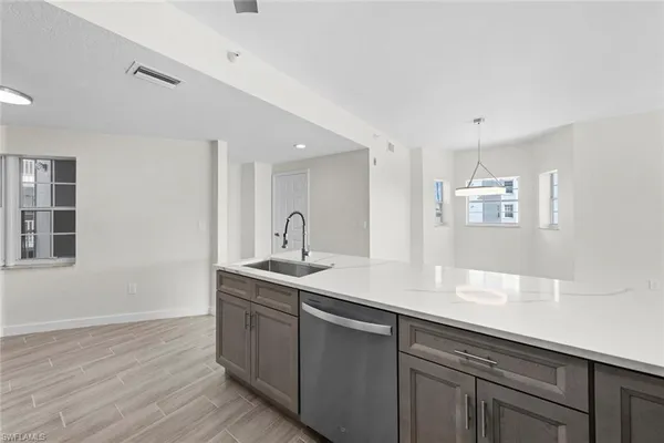 a kitchen with a sink and cabinets