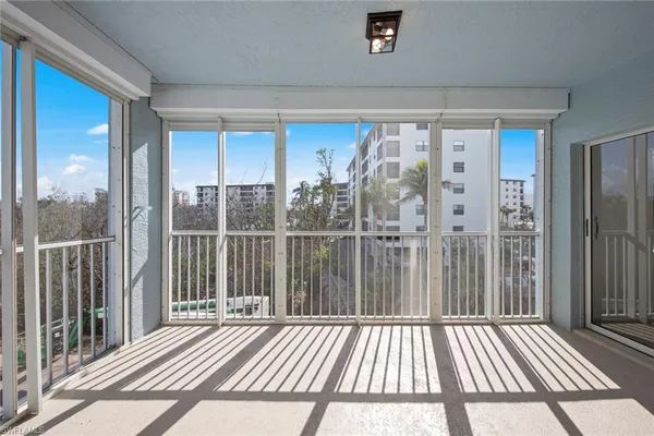 a view of a balcony with wooden floor