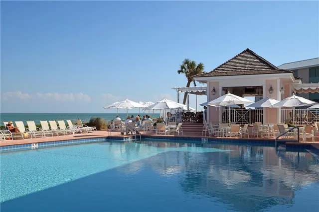 an aerial view of a houses with a yard