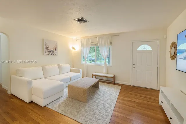 a living room with furniture and a rug