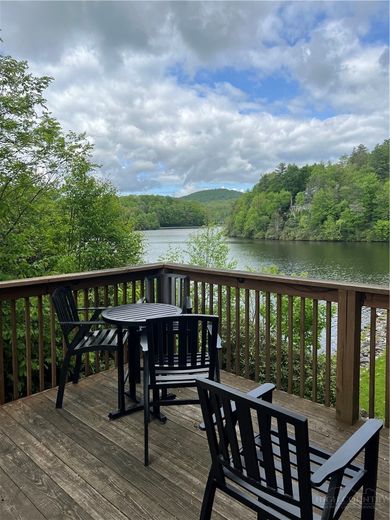 38 Rocky Meadows Road Newland, NC 28657 - Photo 49 of 50 a view of a balcony with wooden floor and outdoor seating