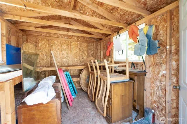 a view of walk in closet with white walls