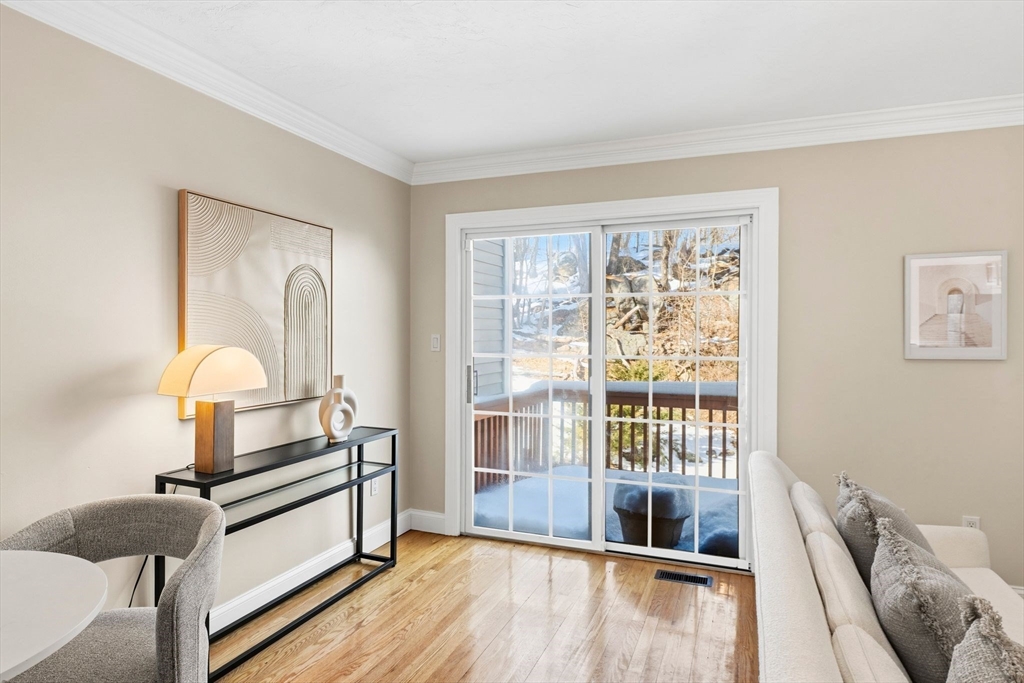 52 Packards Lane, Unit 4 Quincy, MA 02169 - Photo 11 of 40 a living room with furniture and a large window