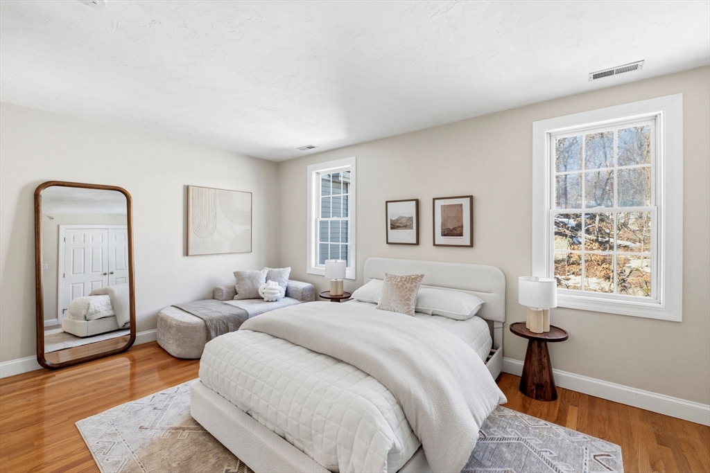 52 Packards Lane, Unit 4 Quincy, MA 02169 - Photo 15 of 40 a bedroom with furniture and a window