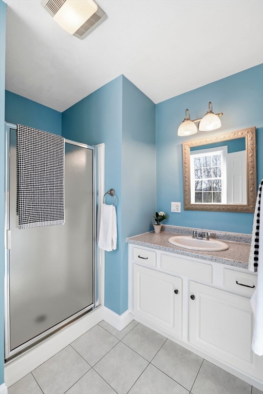 52 Packards Lane, Unit 4 Quincy, MA 02169 - Photo 21 of 40 a bathroom with a sink toilet and shower