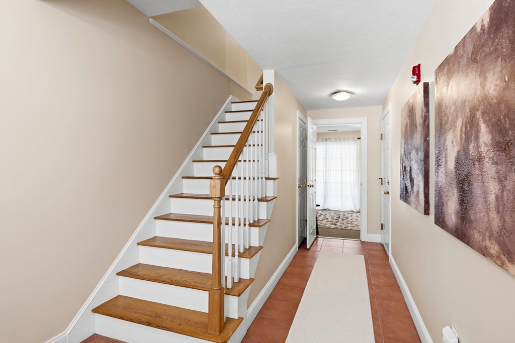 52 Packards Lane, Unit 4 Quincy, MA 02169 - Photo 22 of 40 a view of a hallway with wooden floor and entryway