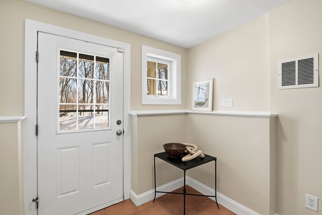 52 Packards Lane, Unit 4 Quincy, MA 02169 - Photo 27 of 40 a view of a livingroom with furniture and windows
