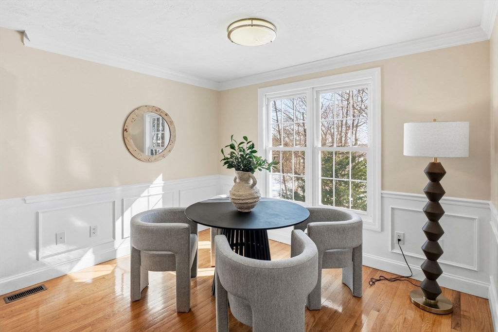 52 Packards Lane, Unit 4 Quincy, MA 02169 - Photo 4 of 40 a view of a dining room with furniture and wooden floor