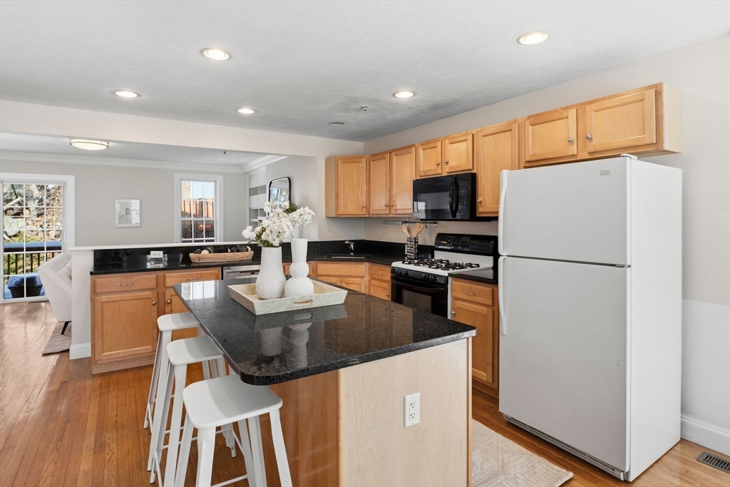 52 Packards Lane, Unit 4 Quincy, MA 02169 - Photo 10 of 40 a kitchen with counter top space cabinets and stainless steel appliances