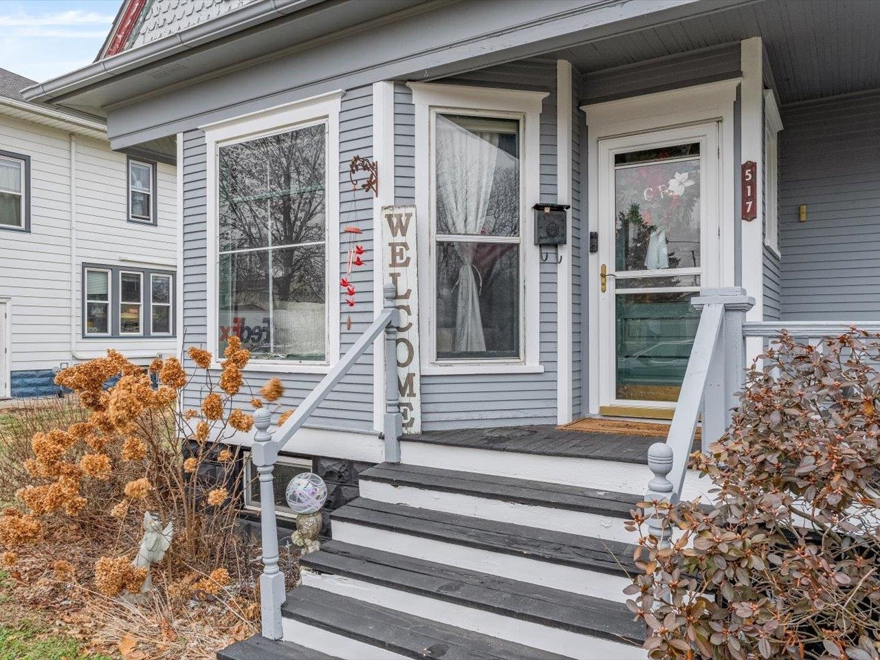 517 12th Street Dewitt, IA 52742 - Photo 12 of 40 a view of a house with a large window and wooden floor