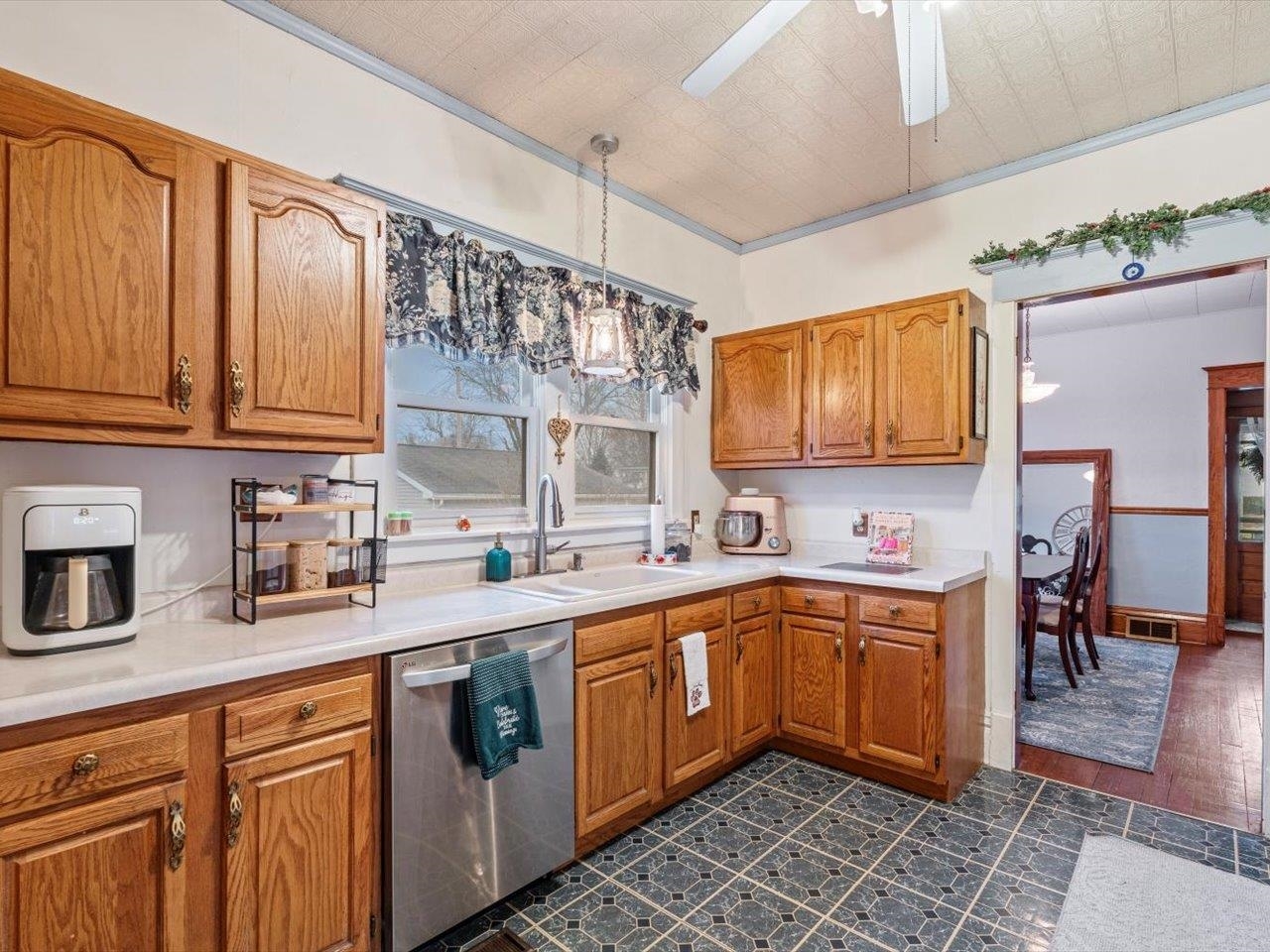 517 12th Street Dewitt, IA 52742 - Photo 19 of 40 a kitchen with stainless steel appliances a sink stove top oven and cabinets