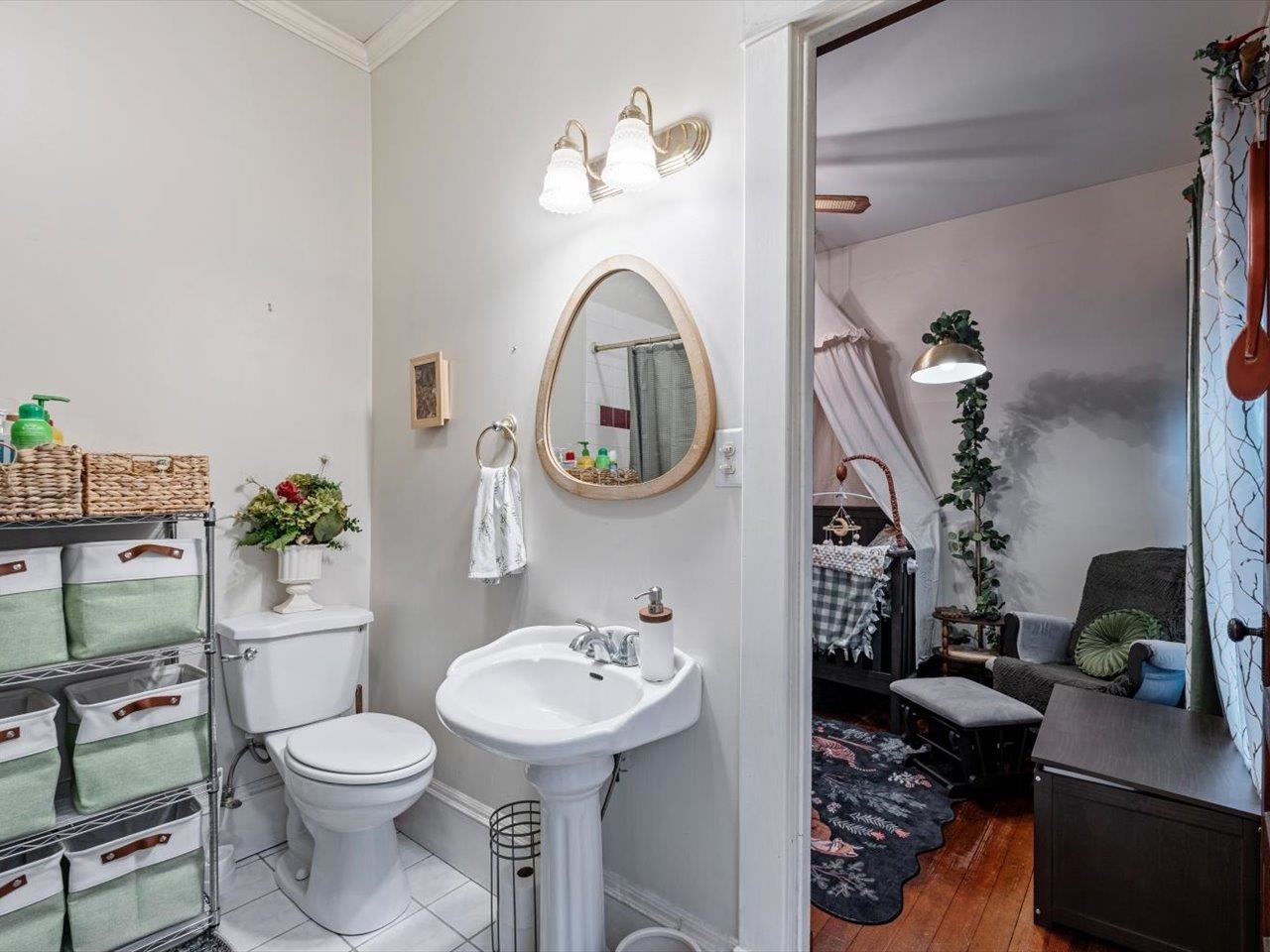 517 12th Street Dewitt, IA 52742 - Photo 25 of 40 a bathroom with a toilet a sink and a mirror