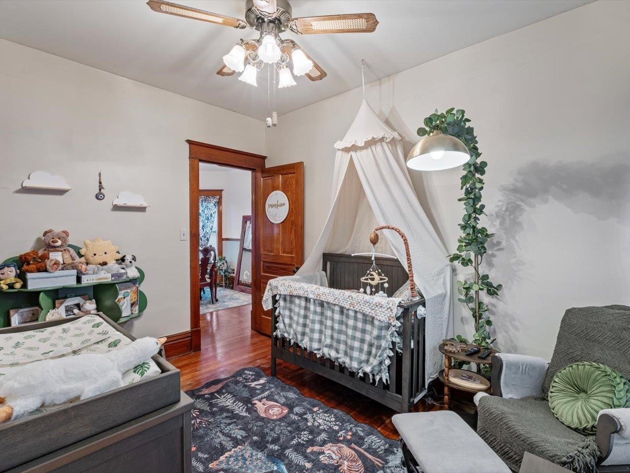 517 12th Street Dewitt, IA 52742 - Photo 26 of 40 a living room with furniture flowerpot and a chandelier