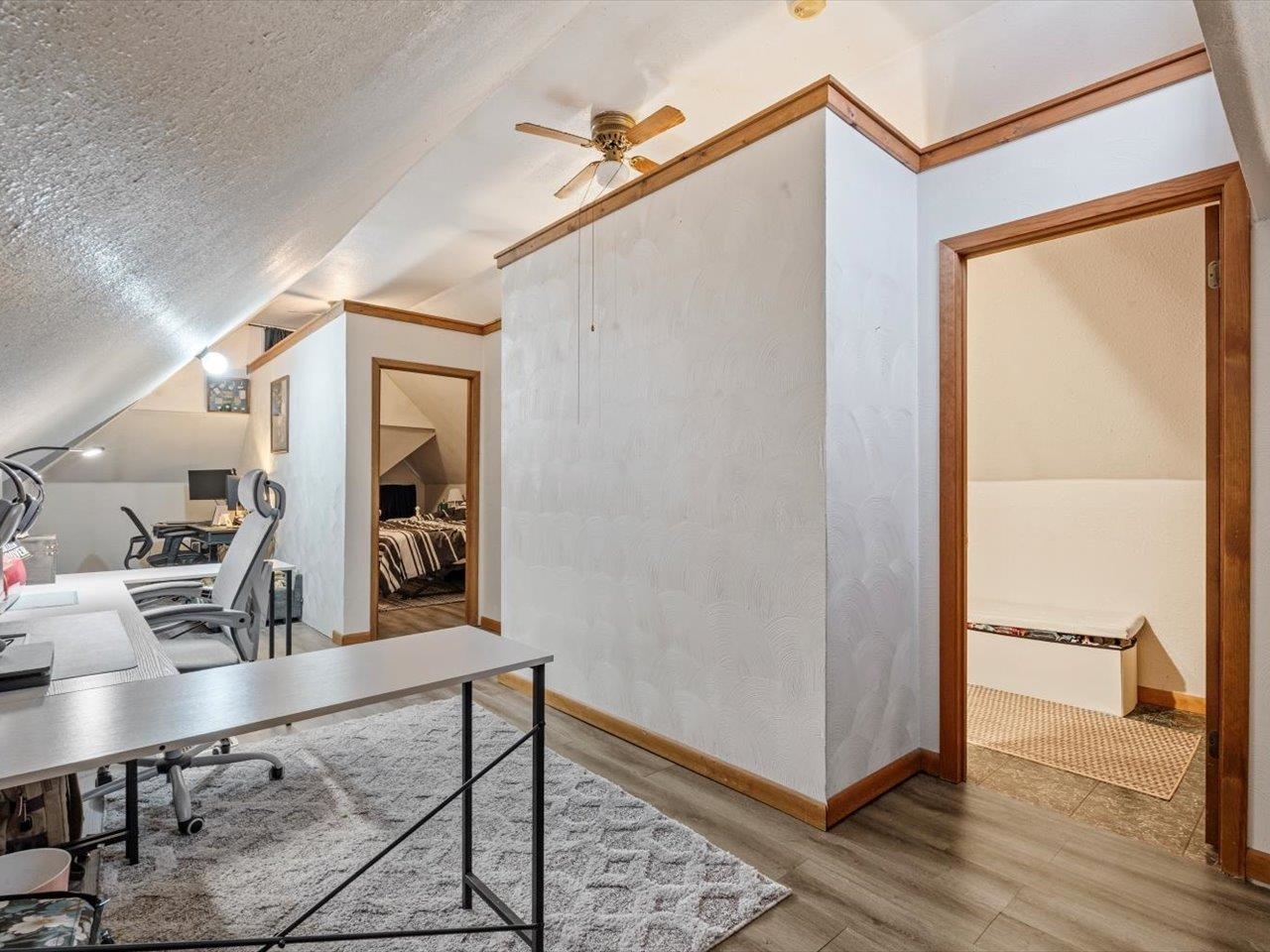 517 12th Street Dewitt, IA 52742 - Photo 31 of 40 a view of a hallway with workspace and wooden floor