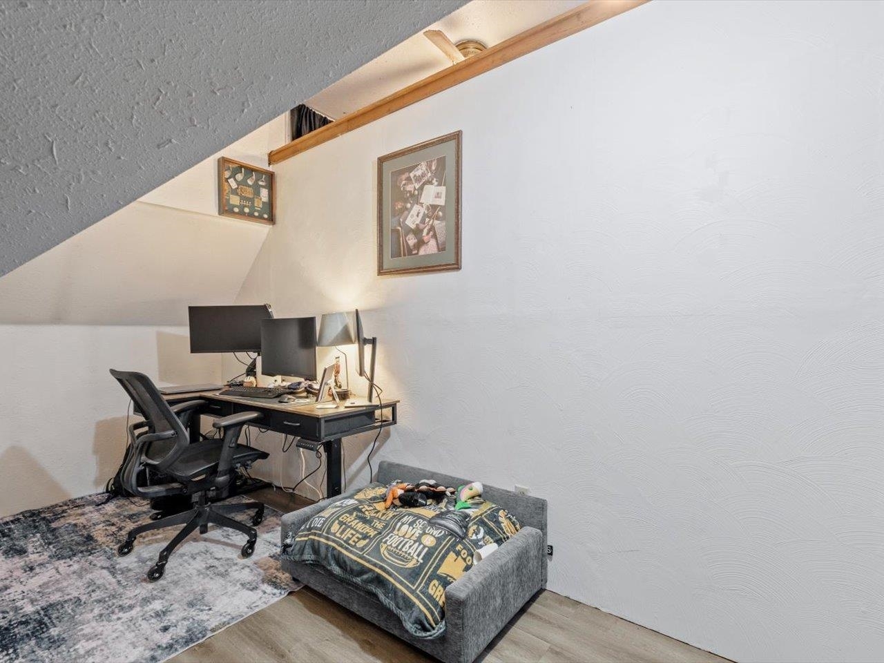 517 12th Street Dewitt, IA 52742 - Photo 33 of 40 a workspace with furniture and painting on the wall