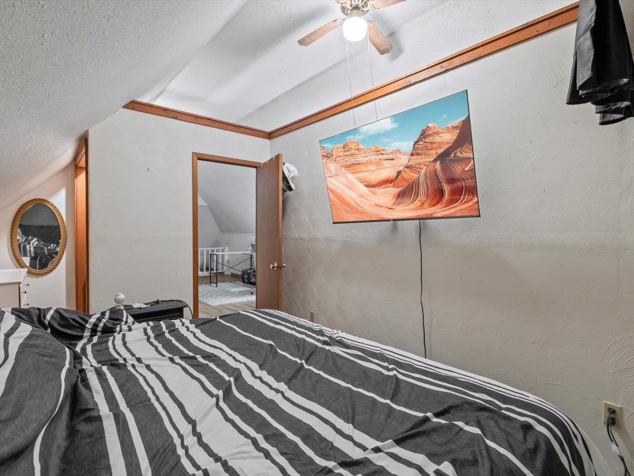 517 12th Street Dewitt, IA 52742 - Photo 36 of 40 a bedroom with a bed and a chandelier