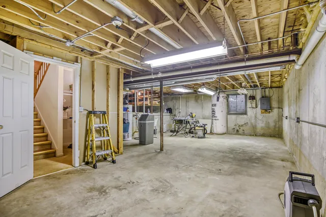 a view of empty room with wooden walls