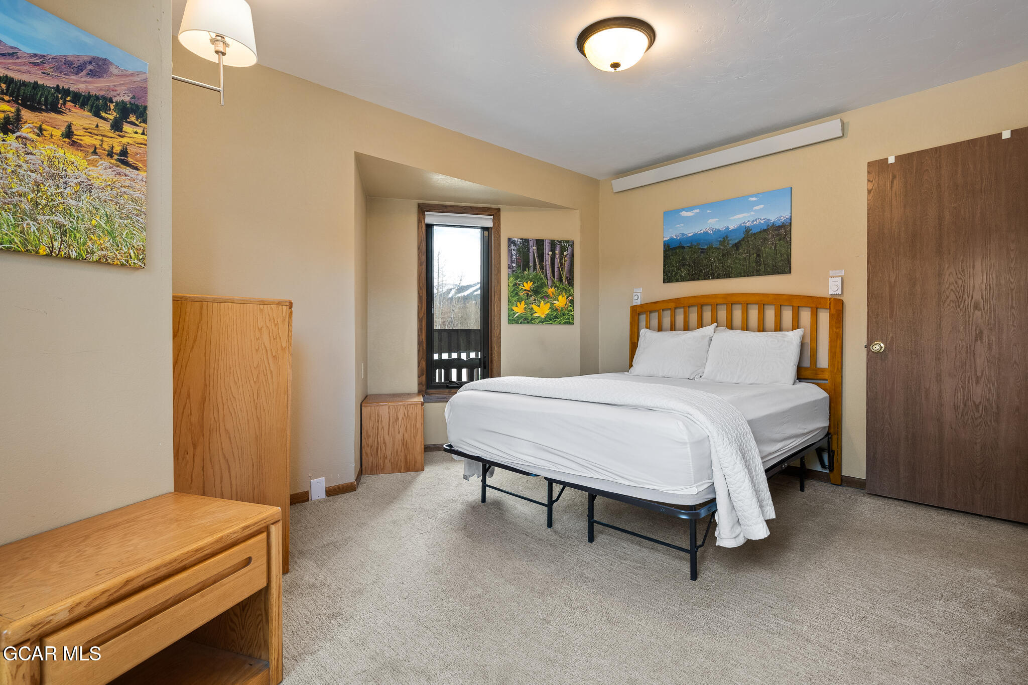 490 Kings Crossing Road, Unit 611 Winter Park, CO 80482 - Photo 28 of 39 a bedroom with a bed and a window