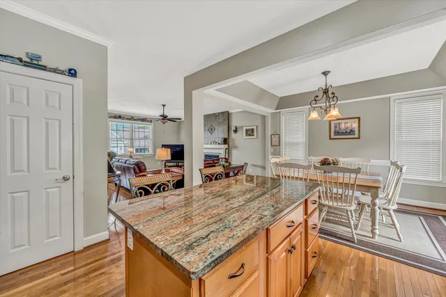 a view of a center kitchen island furniture and wooden floor