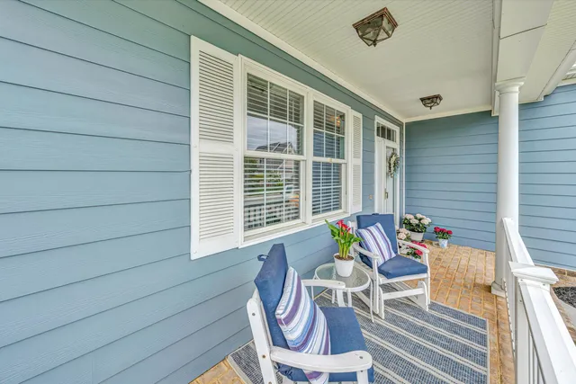a view of a chair and table in the balcony