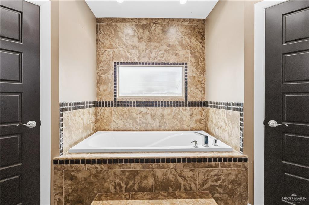 1342 Patsy Cline Drive Edinburg, TX 78541 - Photo 10 of 18 a bathroom with a bathtub and a shower