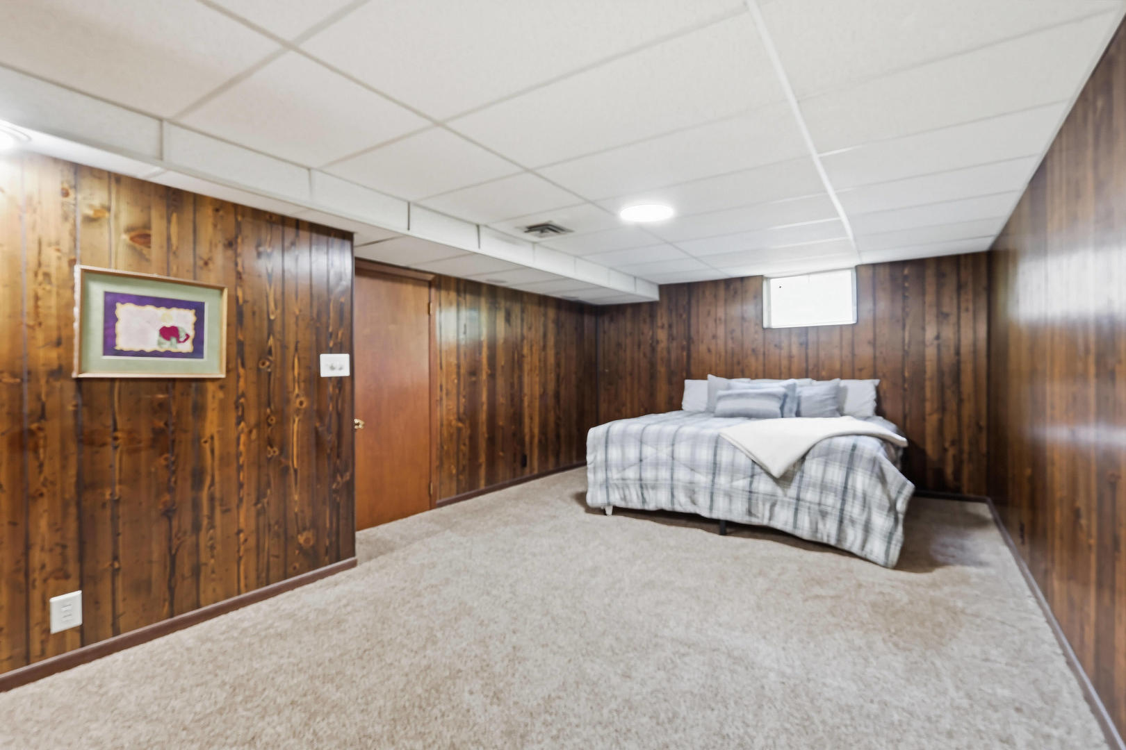 4314 Spring Street Davenport, IA 52807 - Photo 43 of 51 a spacious bedroom with a bed and a table